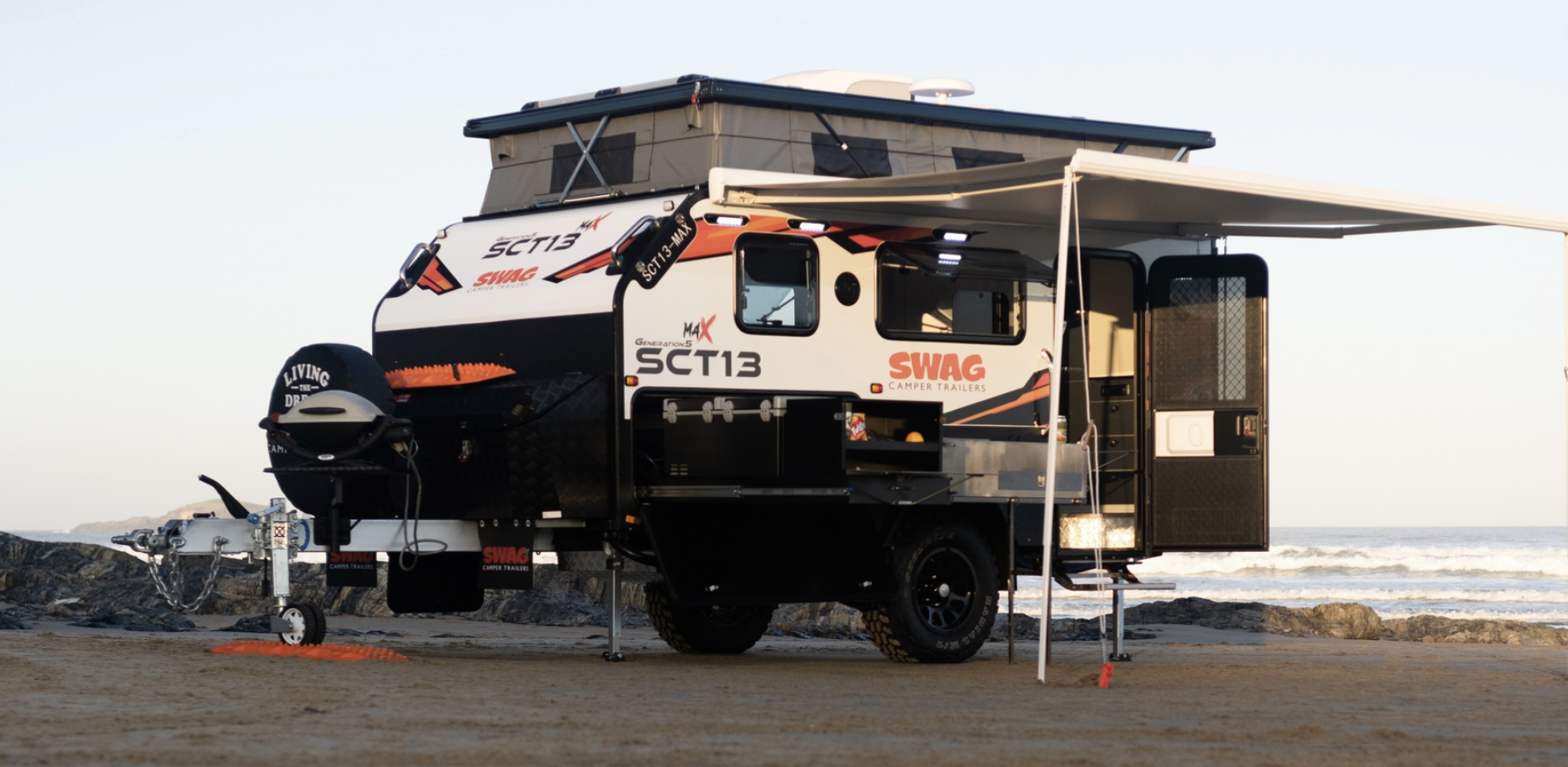 A Camper Trailer And Caravan Side By Side