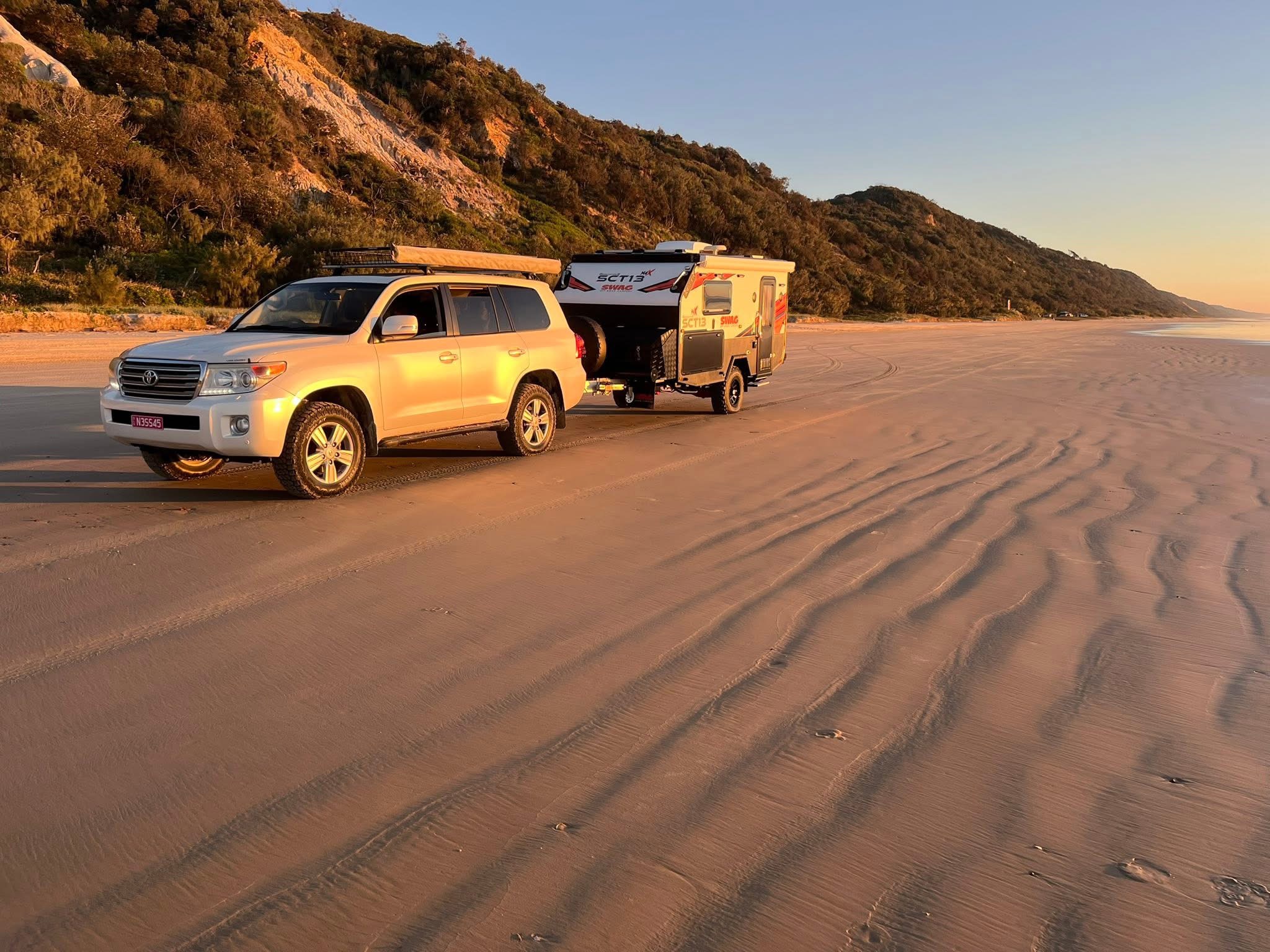 An Off Road Caravan Driving On The Beach