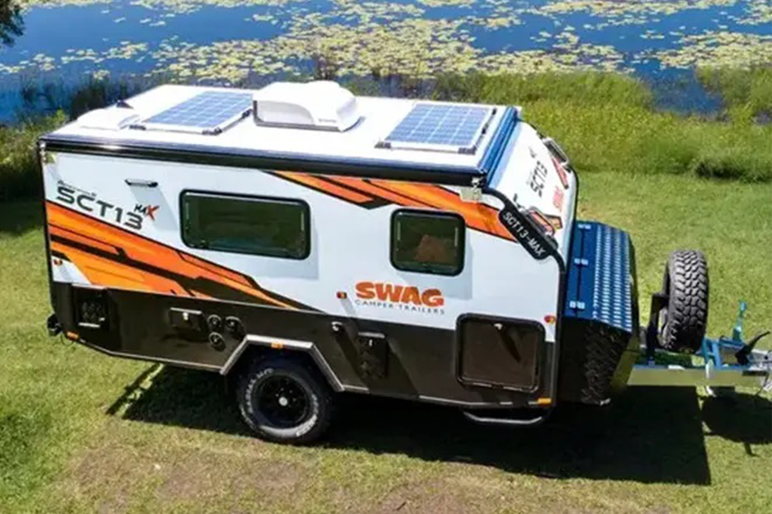 Camper Trailer Beside Water